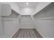 Walk-in closet with carpet, white walls, and hanging rods, offering ample storage space at 2557 E Music Mountain Ave, Apache Junction, AZ 85119