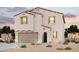 Charming two-story home featuring a tile roof, neutral stucco, and a low-maintenance desert landscape at 2557 E Music Mountain Ave, Apache Junction, AZ 85119