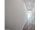 Long hallway with grey wood-look tile, leading to multiple rooms and offering a clean aesthetic at 2557 E Music Mountain Ave, Apache Junction, AZ 85119