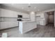Spacious kitchen featuring white cabinetry, granite countertops, stainless steel appliances, and tile floors at 2557 E Music Mountain Ave, Apache Junction, AZ 85119