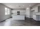 Bright, open kitchen with white cabinets, granite countertops and stainless steel appliances at 2557 E Music Mountain Ave, Apache Junction, AZ 85119