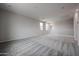 A bright and spacious loft featuring carpet flooring, neutral paint, and natural lighting at 2557 E Music Mountain Ave, Apache Junction, AZ 85119