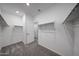 Spacious walk-in closet with carpet flooring, shelving, and hanging racks for ample storage at 2557 E Music Mountain Ave, Apache Junction, AZ 85119