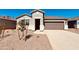 Charming single-story home with a well-maintained front yard, and a two-car garage, perfect for modern living at 30316 N Acacia Dr, Florence, AZ 85132