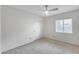 Neutral bedroom with a window, white walls, carpeted floors, and closet at 319 E Hackamore St, Mesa, AZ 85201