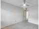 Neutral bedroom features a ceiling fan, white walls, and carpeted floors at 319 E Hackamore St, Mesa, AZ 85201