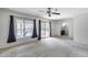 Carpeted bedroom with sliding glass doors leading to a pool and backyard at 319 E Hackamore St, Mesa, AZ 85201