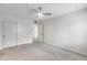 Neutral bedroom featuring closet and doorway with carpeted floors and white walls at 319 E Hackamore St, Mesa, AZ 85201