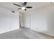 Neutral bedroom featuring closet and doorway with carpeted floors and white walls at 319 E Hackamore St, Mesa, AZ 85201