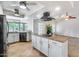 Spacious kitchen with an island, granite countertops, stainless steel appliances, and tiled floors at 319 E Hackamore St, Mesa, AZ 85201