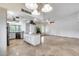 Spacious kitchen with an island, stainless steel appliances, and open layout to the living area at 319 E Hackamore St, Mesa, AZ 85201