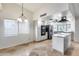 Bright kitchen showcasing modern appliances, a stylish island, and plenty of cabinet space at 319 E Hackamore St, Mesa, AZ 85201