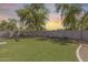 Spacious backyard with lush artificial turf, perfect for recreation, relaxation, and outdoor activities at 11259 W Locust Ln, Avondale, AZ 85323