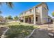 Stunning backyard featuring a well-maintained lawn, fenced patio, and a view of the refreshing pool and home exterior at 11259 W Locust Ln, Avondale, AZ 85323