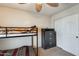 Bedroom featuring a bunk bed, natural light, and closet at 11259 W Locust Ln, Avondale, AZ 85323