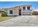 Charming two-story home with a spacious driveway and attached two-car garage at 11259 W Locust Ln, Avondale, AZ 85323