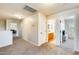 Carpeted upstairs hallway with views of the bathroom and other bedrooms at 11259 W Locust Ln, Avondale, AZ 85323