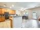 Bright kitchen with stainless steel appliances, breakfast bar, and adjacent dining area at 11259 W Locust Ln, Avondale, AZ 85323