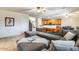 Comfortable living room with a spacious gray sectional sofa and a glimpse of the adjoining kitchen at 11259 W Locust Ln, Avondale, AZ 85323