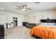 Spacious primary bedroom with vaulted ceiling and fan includes a cozy seating area at 11259 W Locust Ln, Avondale, AZ 85323