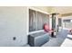 Covered patio area features a small seating area with a heater and enclosed privacy screens at 11259 W Locust Ln, Avondale, AZ 85323