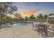 Beautiful backyard pool with rock features and ample space for outdoor dining and lounging, ideal for entertaining guests at 11259 W Locust Ln, Avondale, AZ 85323