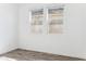 Bright bedroom featuring wood-look floors and a window with exterior view at 12246 E Agave Ln, Florence, AZ 85132