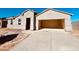 An attractive single-Gathering home shows a large driveway and a convenient two-car garage at 12246 E Agave Ln, Florence, AZ 85132