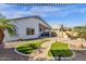 Large, modern backyard with patio, artificial grass, and mature landscaping at 1320 E Binner Dr, Chandler, AZ 85225