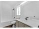 Bright bathroom with modern sink, shower/bath, and a sunlit window at 1320 E Binner Dr, Chandler, AZ 85225