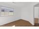Cozy bedroom featuring a bright window and wood floors with fresh paint at 1320 E Binner Dr, Chandler, AZ 85225