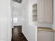 Bright hallway with built in cabinets and shelving unit and tan countertops at 1320 E Binner Dr, Chandler, AZ 85225
