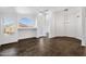 Bright living room featuring tile flooring, ample natural light, and modern ceiling fan and lighting fixtures at 1320 E Binner Dr, Chandler, AZ 85225