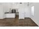 Open-concept living space with tile flooring, a kitchen island, and ample natural light at 1320 E Binner Dr, Chandler, AZ 85225