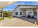 Inviting backyard patio with a table, chairs, and a charming wine barrel at 1320 E Binner Dr, Chandler, AZ 85225