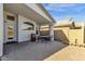 Charming covered patio with a table, chairs, and a wine barrel for outdoor enjoyment at 1320 E Binner Dr, Chandler, AZ 85225