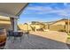 Extended patio space with a table, chairs, and beautiful landscaping at 1320 E Binner Dr, Chandler, AZ 85225