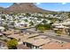 Scenic aerial view of a community nestled in a mountainous landscape with desert landscaping at 14112 N 12Th St, Phoenix, AZ 85022