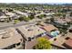 Expansive aerial view showcases this home with a private pool and well-maintained landscaping in a tranquil residential neighborhood at 14112 N 12Th St, Phoenix, AZ 85022
