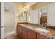 Double vanity with granite countertops and dark wood cabinetry in bathroom at 14112 N 12Th St, Phoenix, AZ 85022
