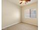 Carpeted bedroom with a window and ceiling fan, offering a cozy space at 14112 N 12Th St, Phoenix, AZ 85022