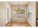 Cozy dining area with lots of natural light, tile flooring, and backyard access at 14112 N 12Th St, Phoenix, AZ 85022