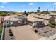 Stunning front elevation featuring an arched entryway, a spacious driveway, and beautifully landscaped garden beds at 14112 N 12Th St, Phoenix, AZ 85022
