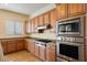 Chef's kitchen with stainless steel appliances, granite countertops and abundant cabinet space at 14112 N 12Th St, Phoenix, AZ 85022