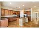 Bright kitchen boasts custom cabinets, granite countertops, stainless steel appliances, and tile floors at 14112 N 12Th St, Phoenix, AZ 85022