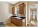 Laundry room with cabinets, countertop, and view of the hallway at 14112 N 12Th St, Phoenix, AZ 85022
