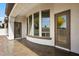 Covered patio with multiple windows offering serene views, outdoor living space at 14112 N 12Th St, Phoenix, AZ 85022