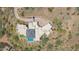 Stunning aerial view of a modern home showcasing a backyard pool and lush desert landscaping at 15332 E Hidden Springs Trl, Fountain Hills, AZ 85268