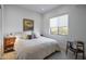 This bright, modern bedroom offers comfort with a cozy bed and window views at 15332 E Hidden Springs Trl, Fountain Hills, AZ 85268