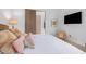 Comfortable bedroom with decorative pillows and a wall-mounted television creates a cozy and inviting space at 15332 E Hidden Springs Trl, Fountain Hills, AZ 85268